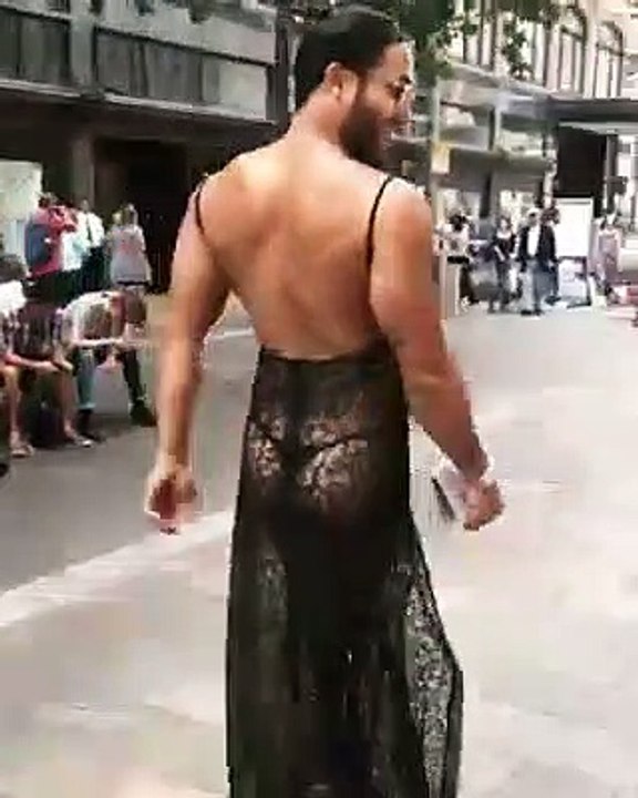 Astonishing events, this man walks on the street wearing a female dress