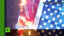 [Actualité] Un drapeau des Etats-Unis brûlé lors de la manifestation de Million Mask March à Londres
