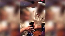 Un enfant boit une bière cul-sec, encouragé par ses parents...