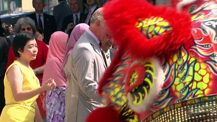 Camilla tries her hand at puppetry in Malaysia
