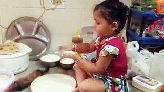 Little Girl is making her own Roti