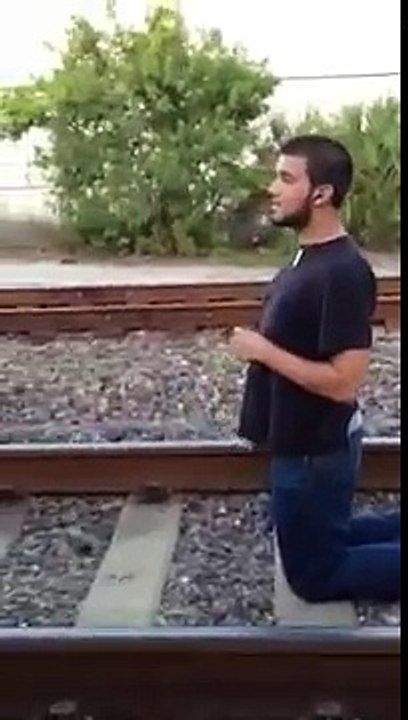 Guy Lays Under Moving Train (Original)