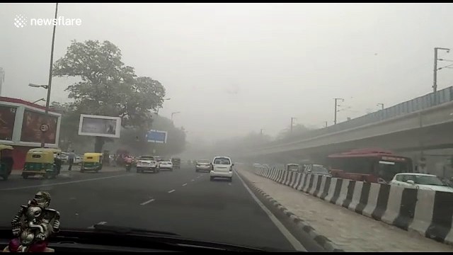 Drive shot through New Delhi street as city chokes under smog