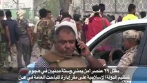 A pro Government militia fighter is surprised by an ISIS suicide bomber in Aden