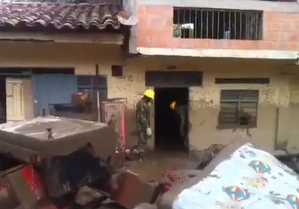 River Overflow Floods Colombian Town With Mud