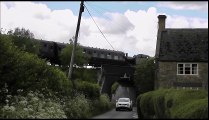 Steam Engine Pulling a Train of 6 Coaches over a Bridge in the UK
