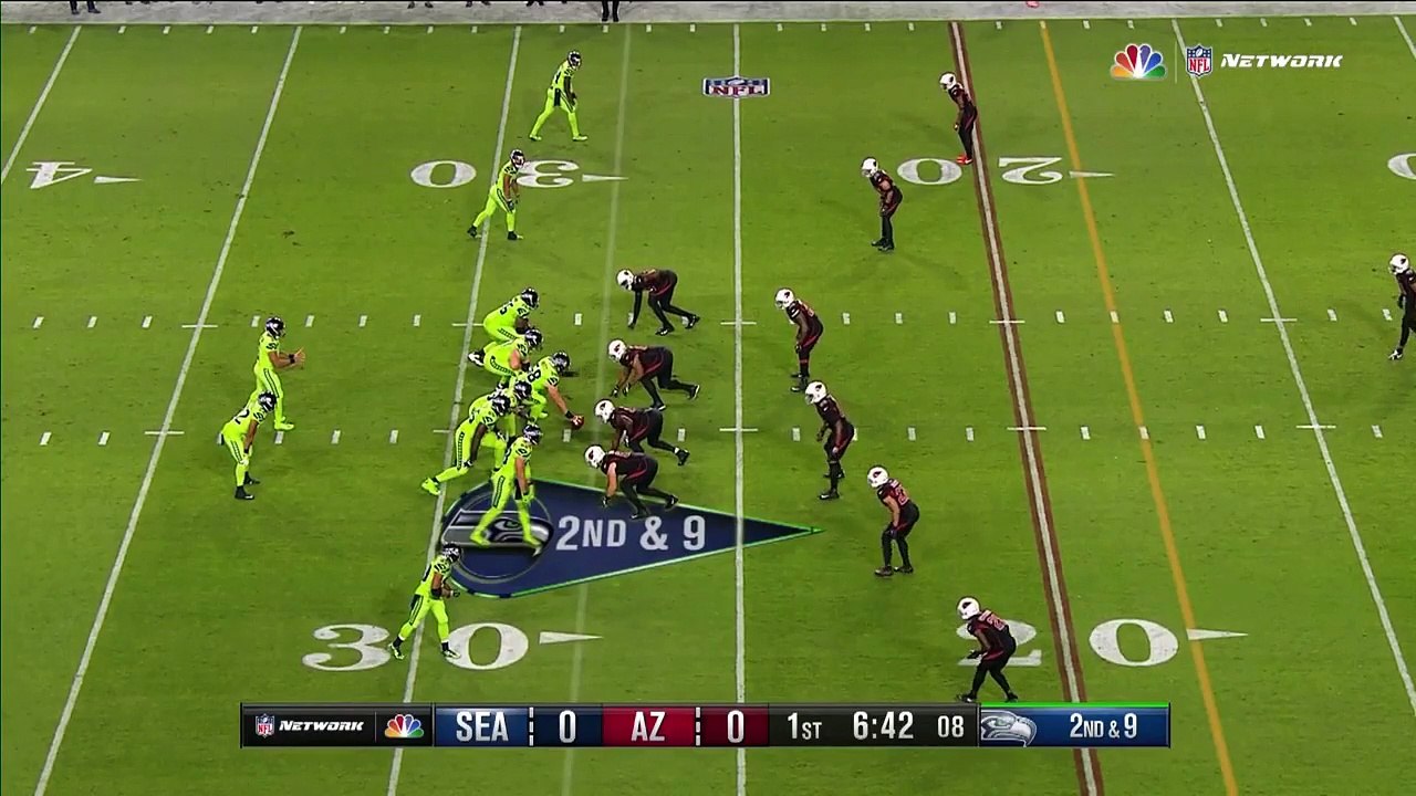 Seattle Seahawks quarterback Russell Wilson lasers pass past Patrick Peterson, wide receiver Doug Baldwin takes off