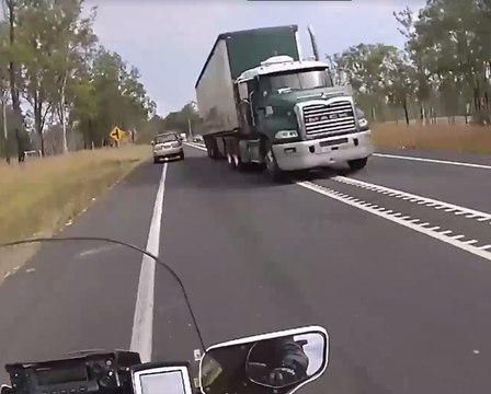 Truck Swerves Dangerously Close to Police Motorbike on Queensland Highway