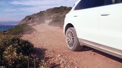 Porsche Cayenne in White Driving off road