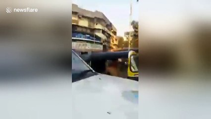 Mumbai police tow car with woman breastfeeding baby inside