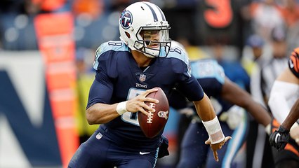 Marcus Mariota pump fakes defender and scrambles for crucial first down