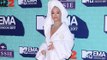 Rita Ora attends MTV EMAs red carpet in bathrobe
