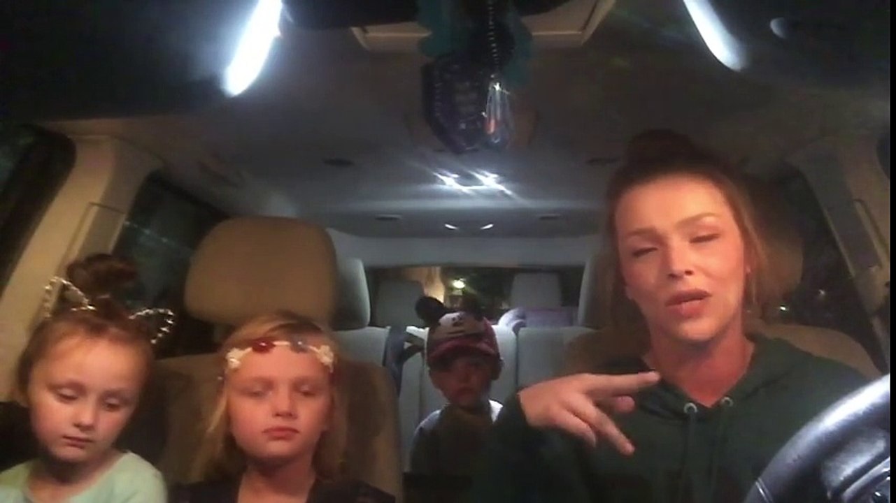 Woman raps in car with kids