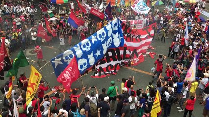 Anti-Trump protesters burn US flag in Manila