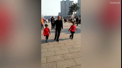 Chinese girls and an elderly man show off their dancing skills