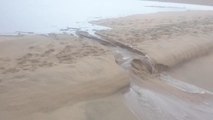 Black Rock River ( mahlongwa) river breaching into the Indian ocean