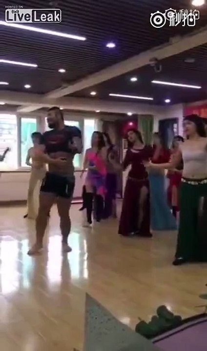 Instructor teaches girls how to dance