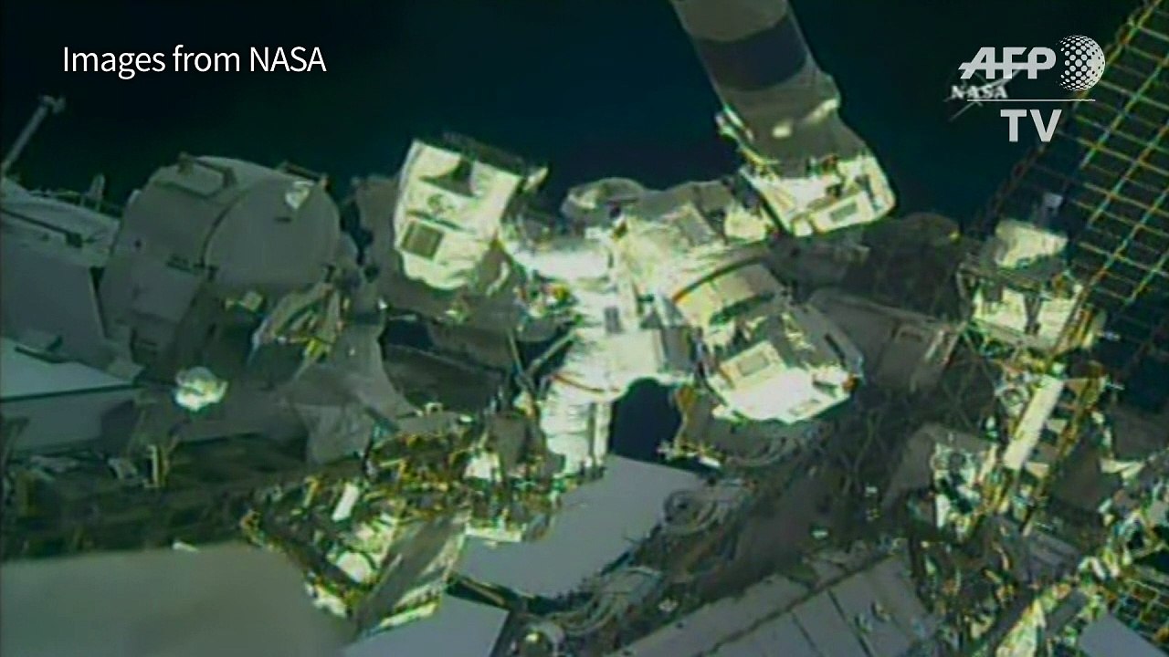 Two US spacewalkers start work on robotic arm r...