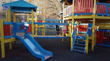 Winter day,children playing at the playground
