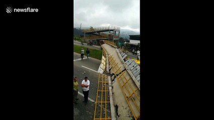 Truck destroys pedestrian bridge on highway near Bogota