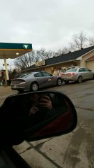 Driver Rams into Police Car at Gas Station