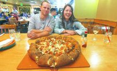 This Couple Took The Beaujos Challenge and Tried to Eat a 14 Pound Pizza In an Hour