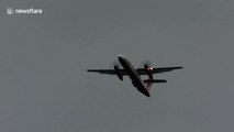 Plane struggles to land in strong winds at Dusseldorf airport