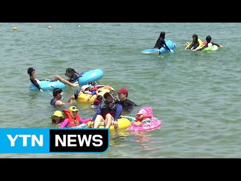 장마 '주춤' 더위 '기승'...해수욕장 더위 사냥 / YTN