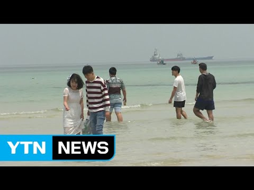 때 이른 더위에 나들이객은 시원한 바다로! / YTN