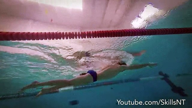 Swimming freestyle position. Pullbouy and paddles