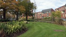 Theresa May tours housing site