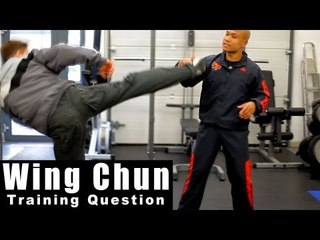 Wing Chun training - wing chun how to deal with high round kick.Q11