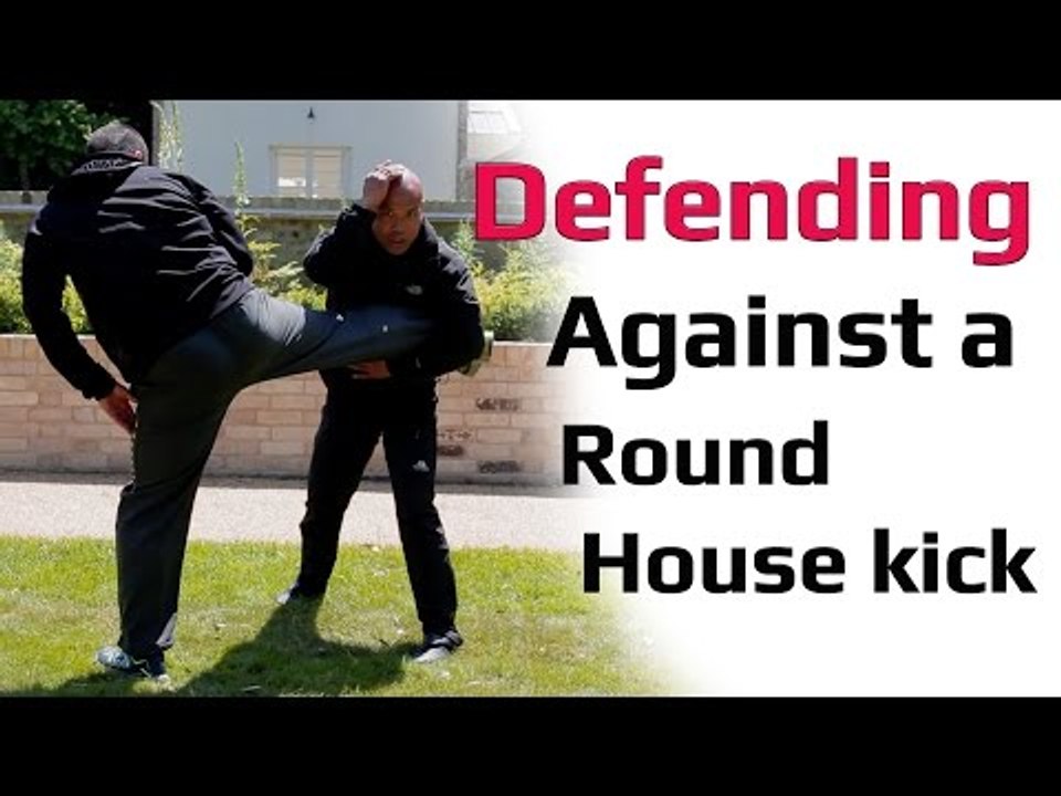 Defending against a roundhouse kick