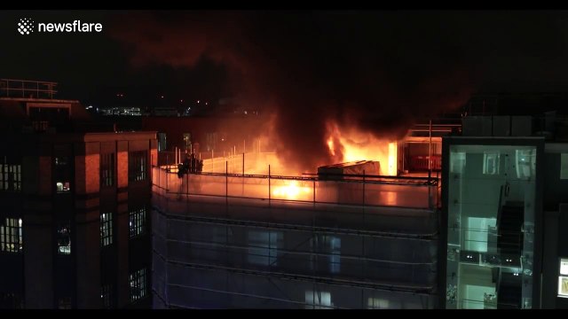 Firefighters tackle blaze on roof of London building