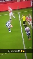 Referee Jon Moss nutmegging Alexis Sanchez