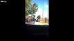 Masked police enter a yard and told off by old black woman