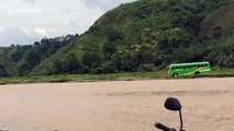 School bus driver takes risky shortcut through flooded river