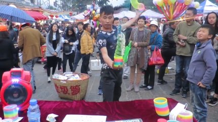 Chinese Slinky Salesman Shows Off His Mad Skills
