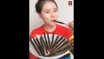 Chinese girl eating the different types of insects