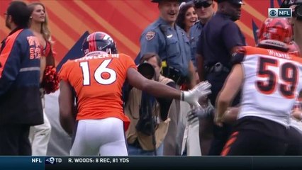 Bennie Fowler ducks under a tackle, takes off for 18 yards