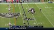 Oakland Raiders quarterback Derek Carr improvises to get ball to running back Marshawn Lynch