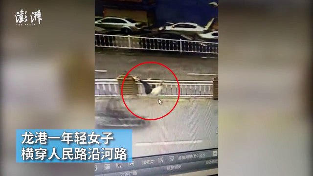 WATCH Woman somehow manages to get her head stuck while hopping over road barrier
