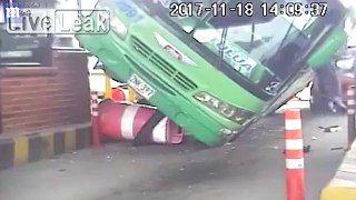 Shocking moment bus smashes into car in line at tollbooth