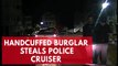 Dashcam video shows handcuffed burglary suspect stealing police car