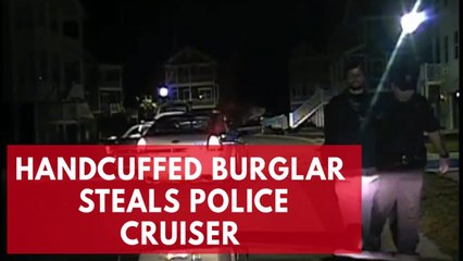 Download Video: Dashcam video shows handcuffed burglary suspect stealing police car