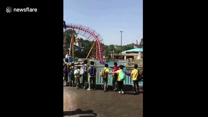 Boy's friends run away leaving him to get drenched by roller coaster