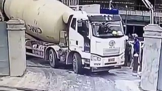 Cement truck falls down in a big hole