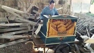 Man Plays Smooth Criminal on Barrel Organ