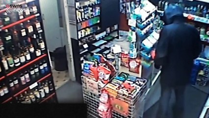 Incredible CCTV footage shows moment female corner shop worker confronts knifeman with own blade