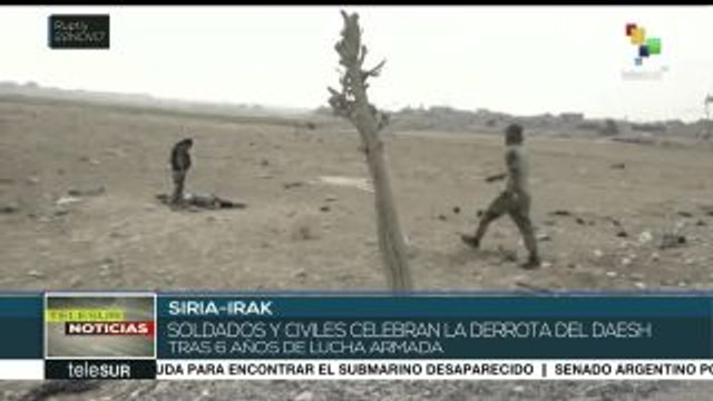 Sirios e iraquíes festejan la derrota de Estado Islámico